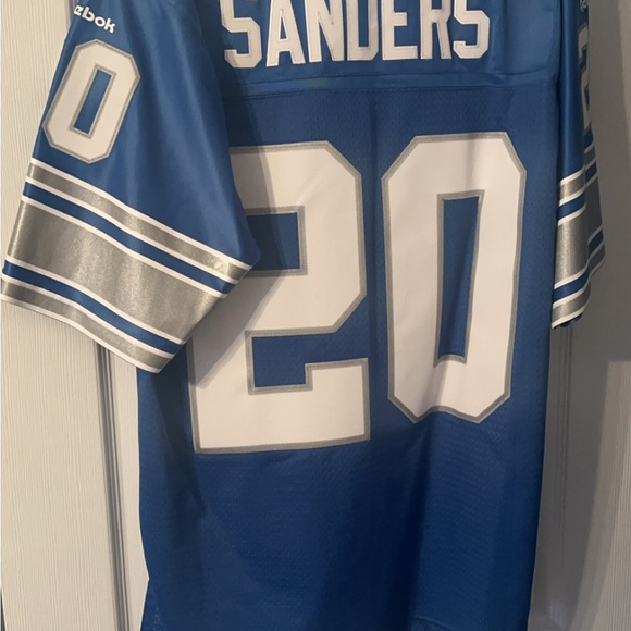 This is a Detroit Lions Barry Sanders throwback jersey by Reebok stitched - Picture 6 of 6